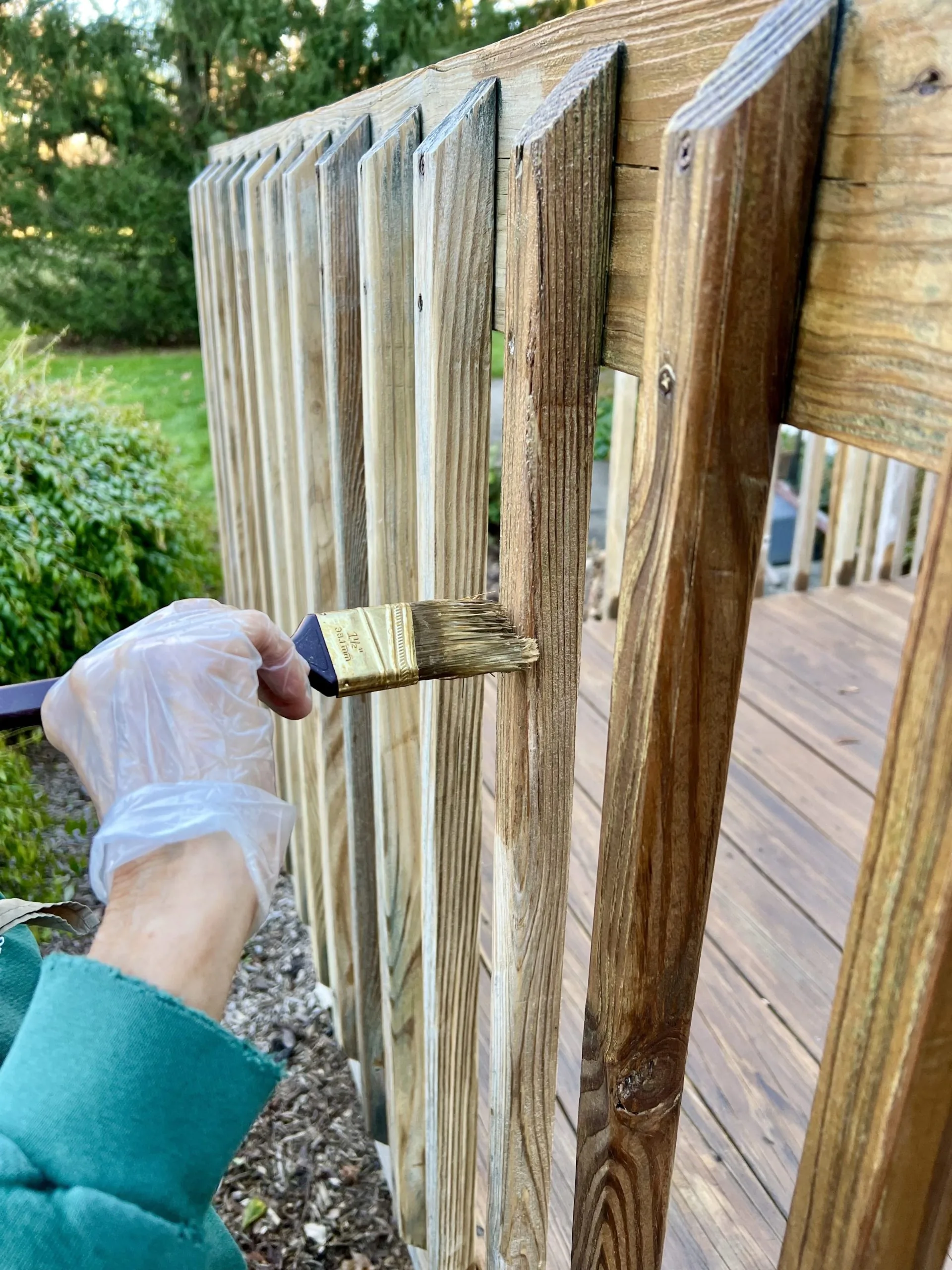 Deck fence and railing staining with brush application by Bos-Flo Coatings St. Petersburg